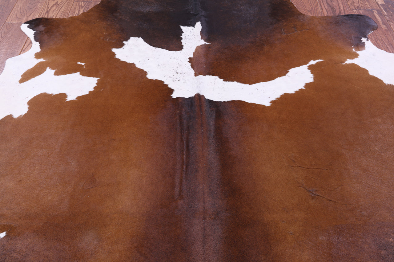 Brown & White Natural Cowhide Rug - Medium 6' 3"H x 5' 7"W