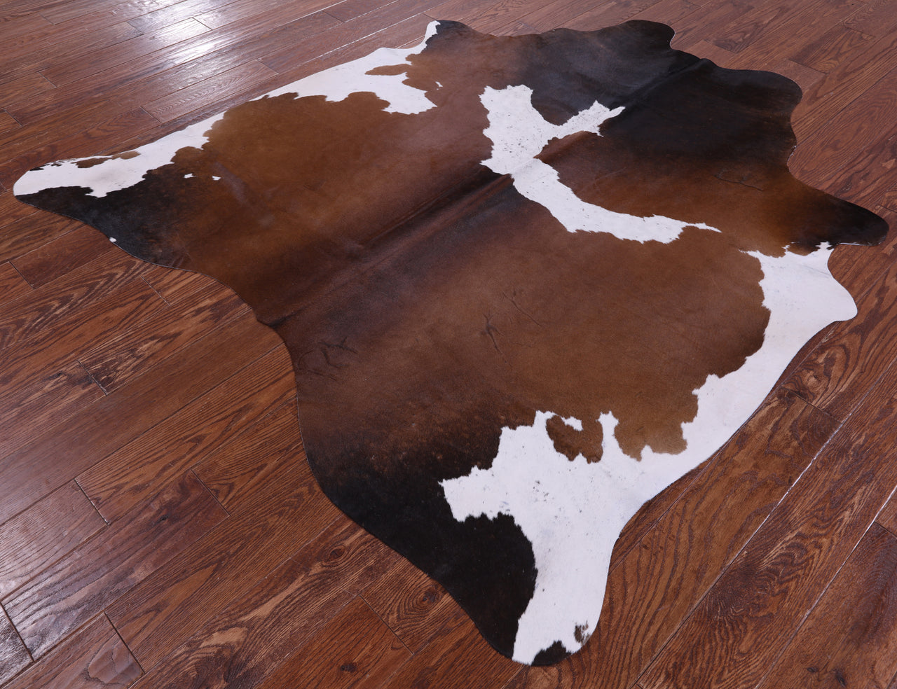 Brown & White Natural Cowhide Rug - Medium 6' 3"H x 5' 7"W