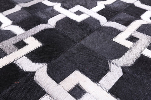 Black Patchwork Natural Cowhide Rug - 5' 0