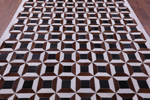 Brown & White Patchwork Natural Black Cowhide Rug - 7' 0