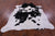 Black & White Natural Cowhide Rug - X-Large 7' 5"H x 6' 7"W