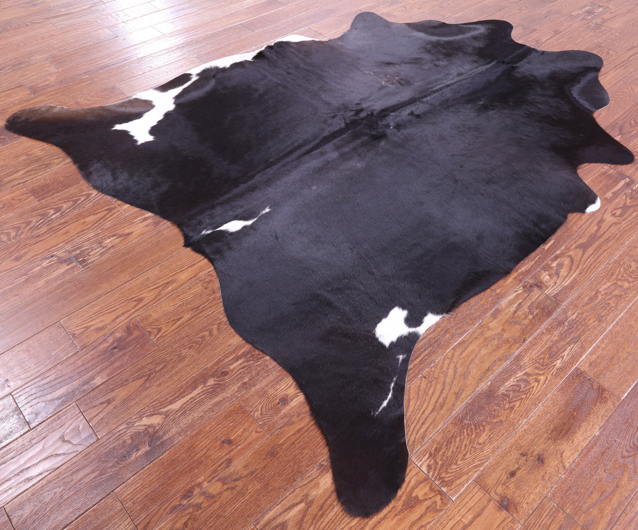 Black Natural Cowhide Rug - X-Large 7' 4"H x 6' 6"W