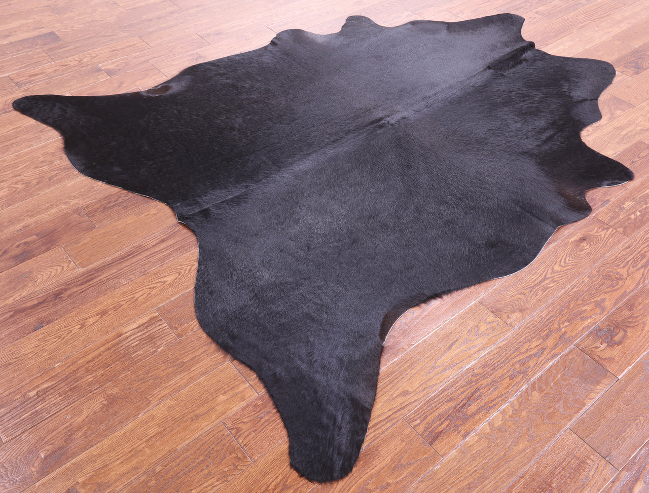 Black Natural Cowhide Rug - X-Large 7' 2"H x 6' 1"W