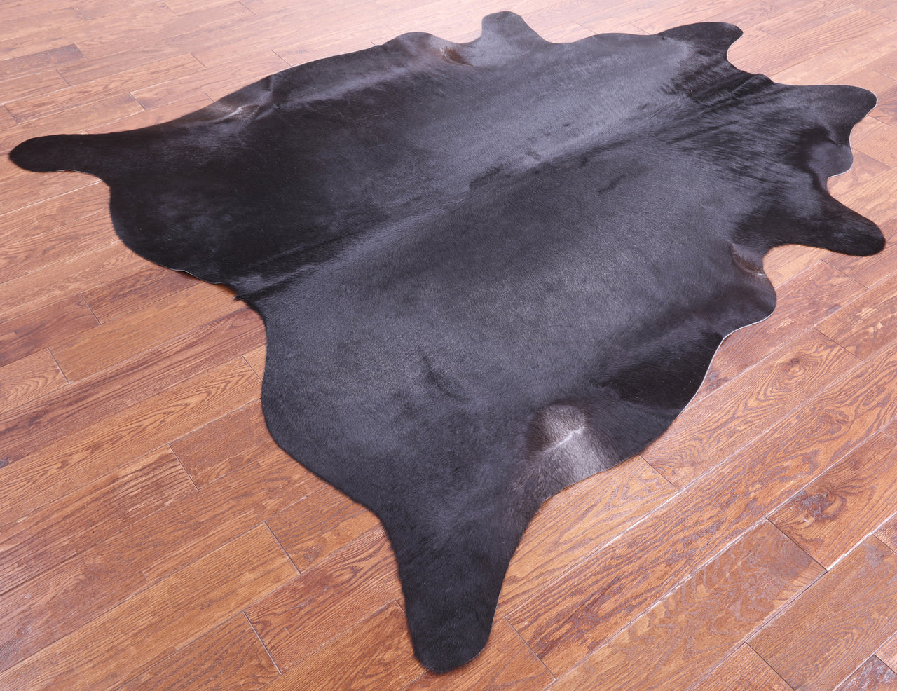 Black Natural Cowhide Rug - X-Large 7' 2"H x 6' 0"W
