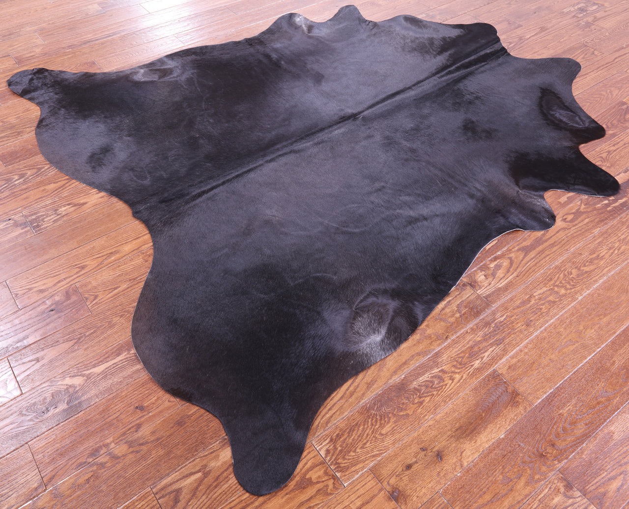 Black Natural Cowhide Rug - X-Large 7' 3"H x 6' 8"W