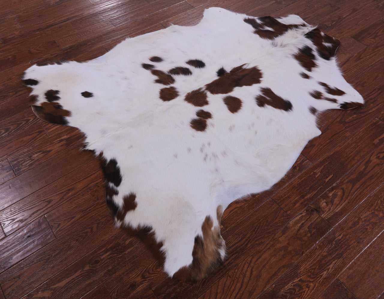 Brown & White Natural Cowhide Rug - Small 5'11"H x 5'3"W